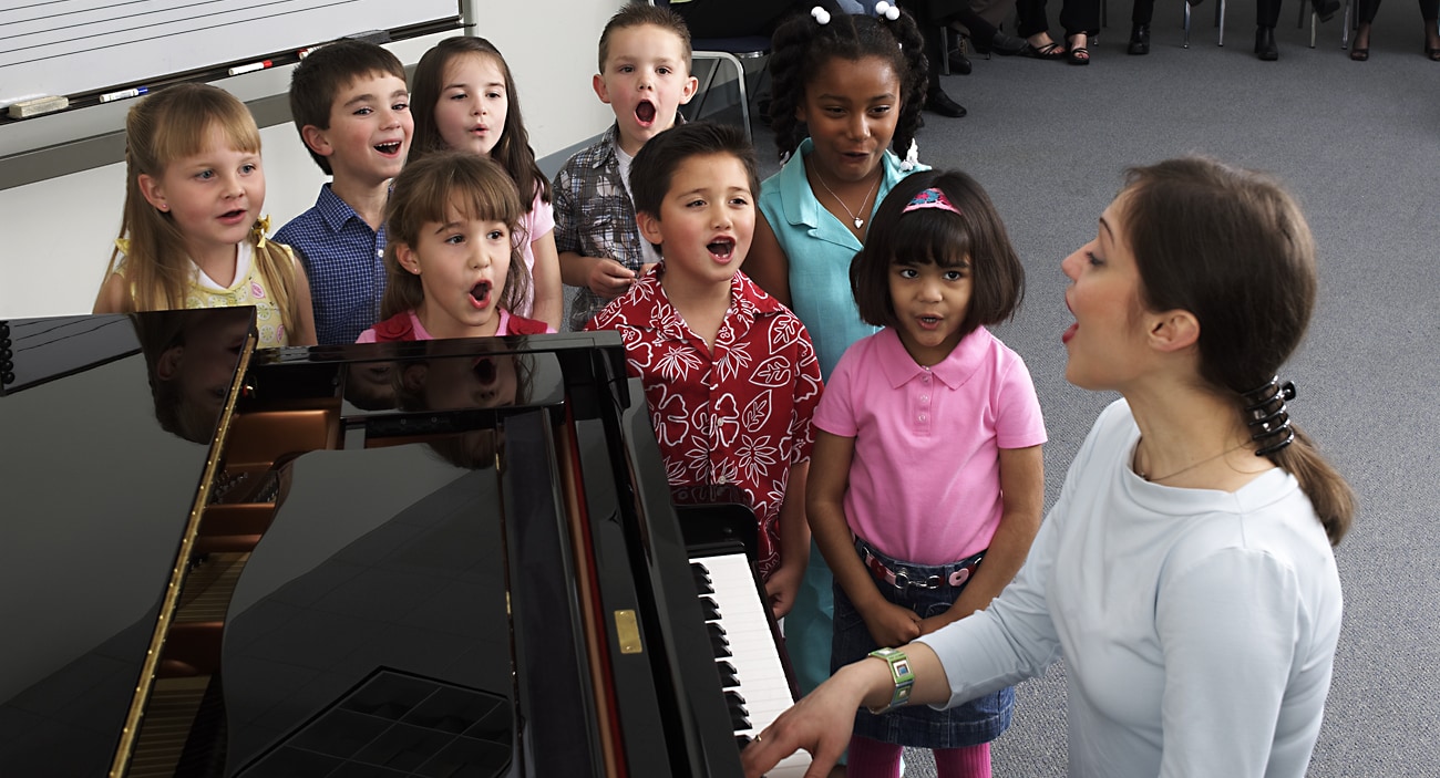 Yamaha Music School piano teacer with kids