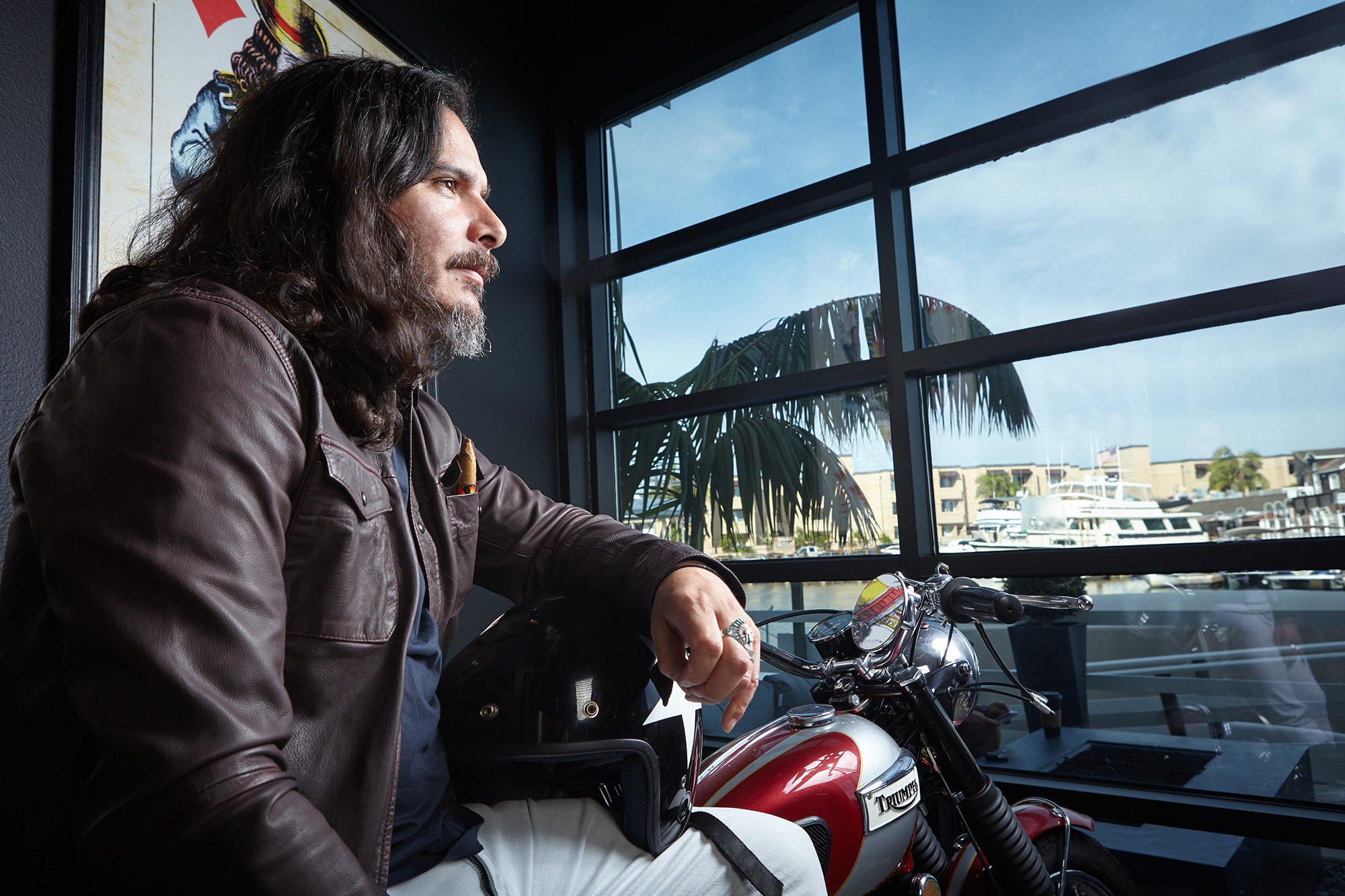 Martin Majano sitting on a Triumph motorcycle