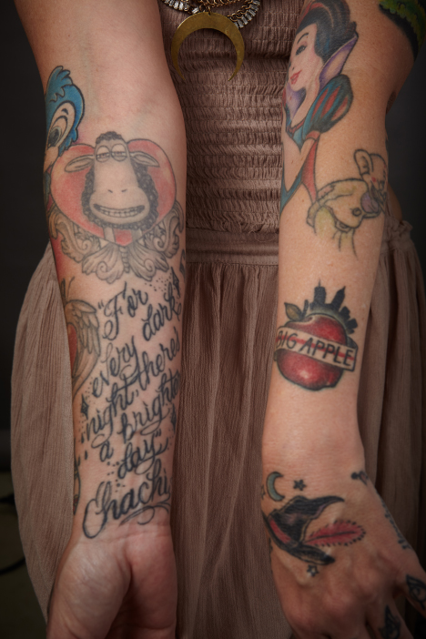 Princess Hilla showinf tatoos on her arms